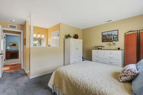 a bedroom with a bed and a cabinets