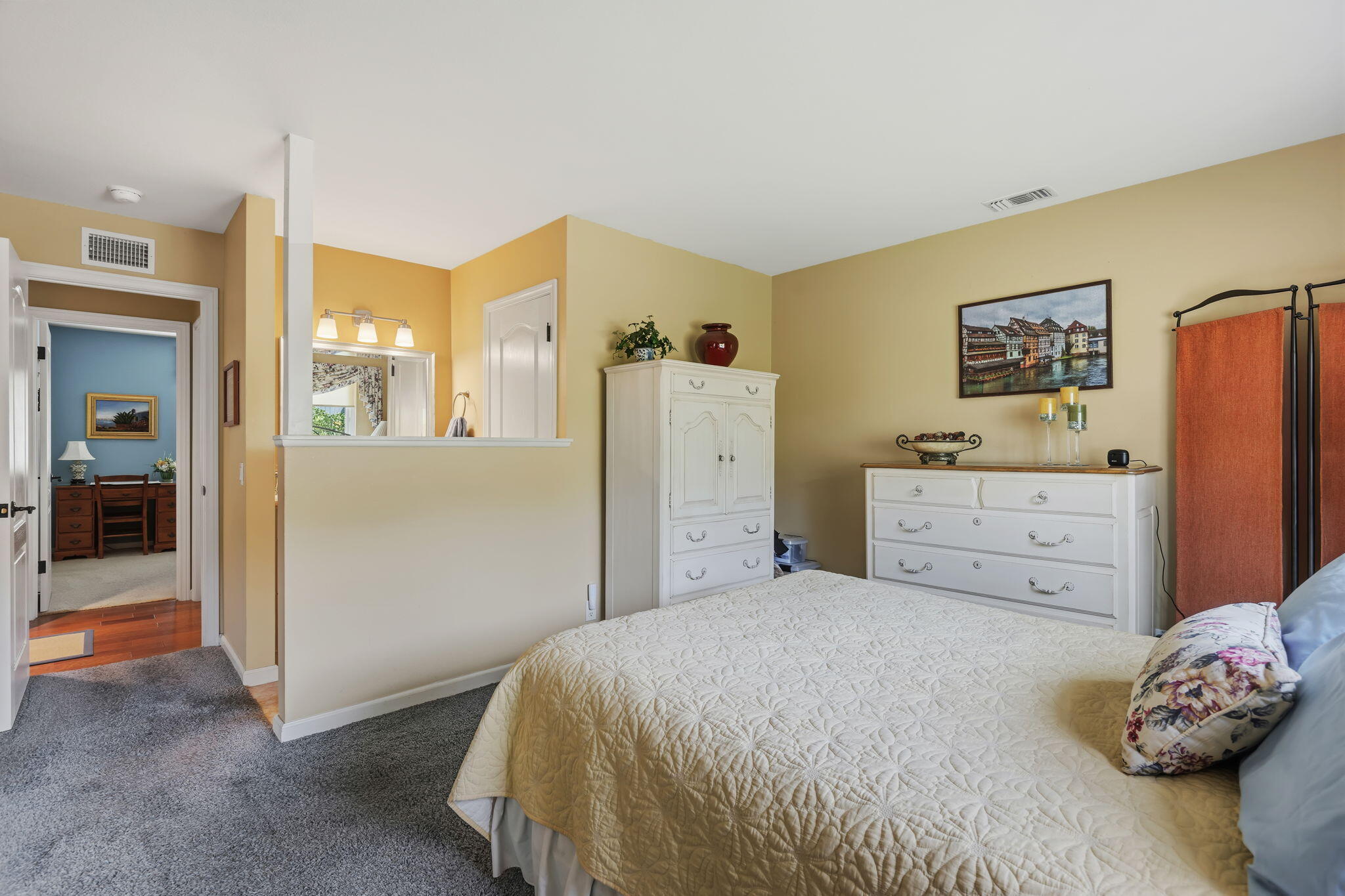 6020 Paseo Palmilla Goleta, CA 93117 - Photo 23 of 33 a bedroom with a bed and a cabinets