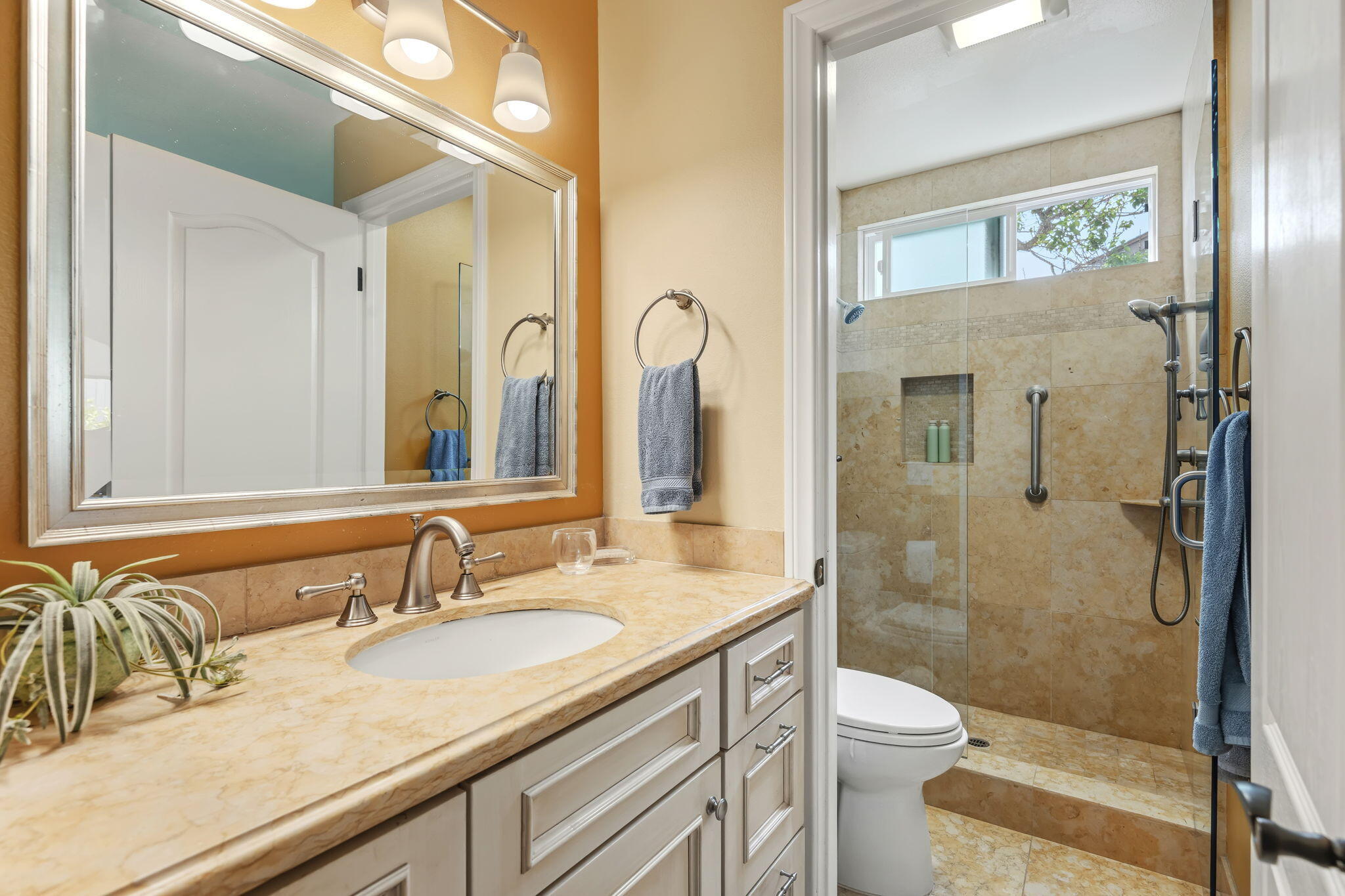 6020 Paseo Palmilla Goleta, CA 93117 - Photo 24 of 33 a bathroom with a granite countertop sink mirror vanity and toilet