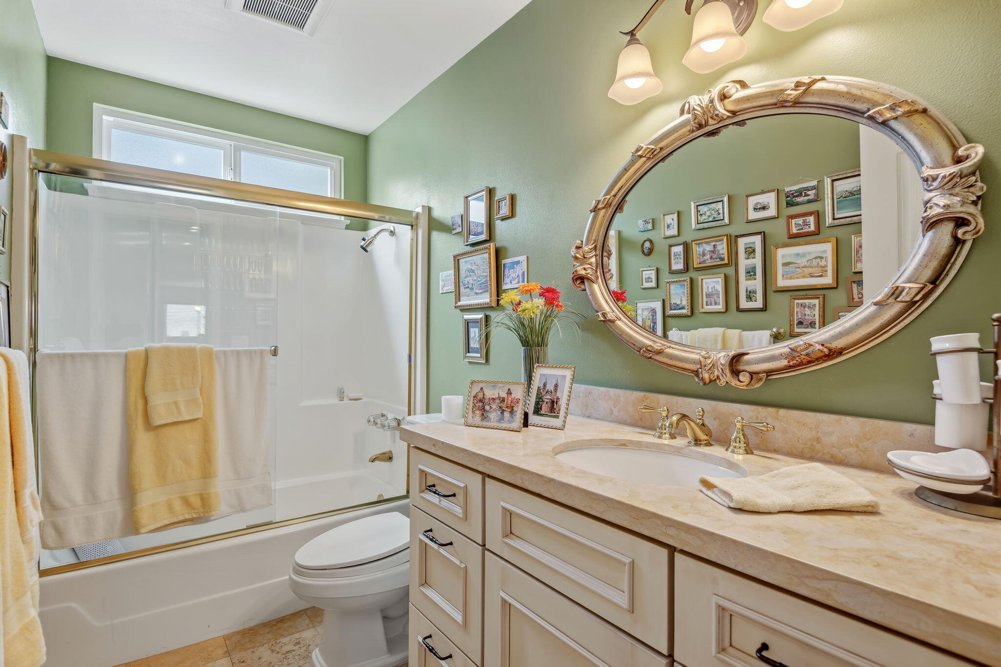 6020 Paseo Palmilla Goleta, CA 93117 - Photo 26 of 33 a bathroom with a granite countertop toilet a sink a mirror a vanity and a shower
