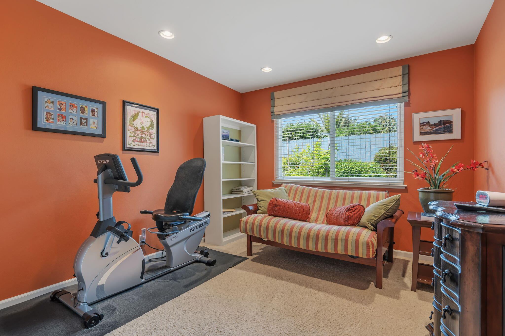 6020 Paseo Palmilla Goleta, CA 93117 - Photo 28 of 33 a living room with furniture a bookshelf and a large window