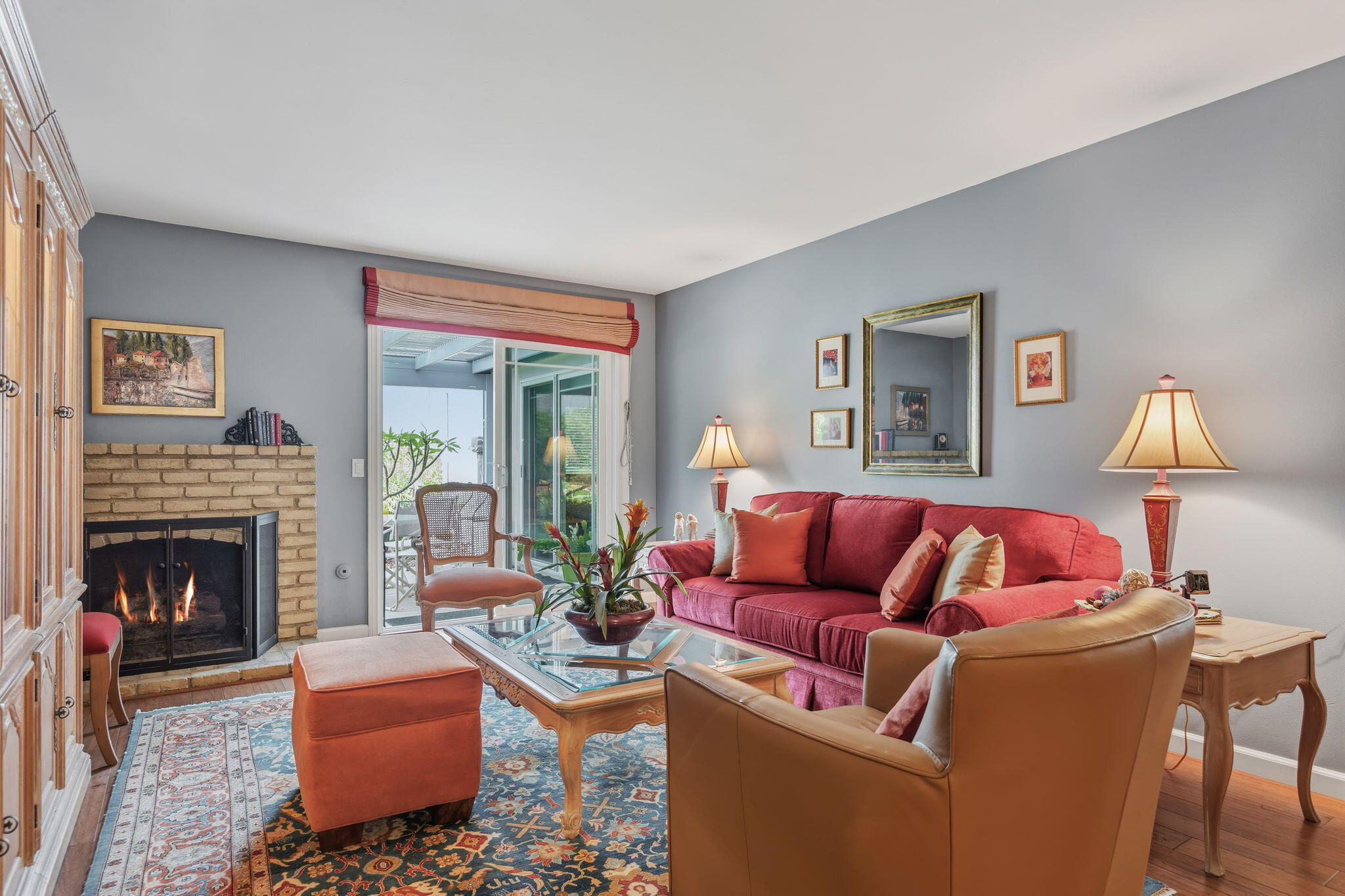 6020 Paseo Palmilla Goleta, CA 93117 - Photo 7 of 33 a living room with furniture and a fireplace