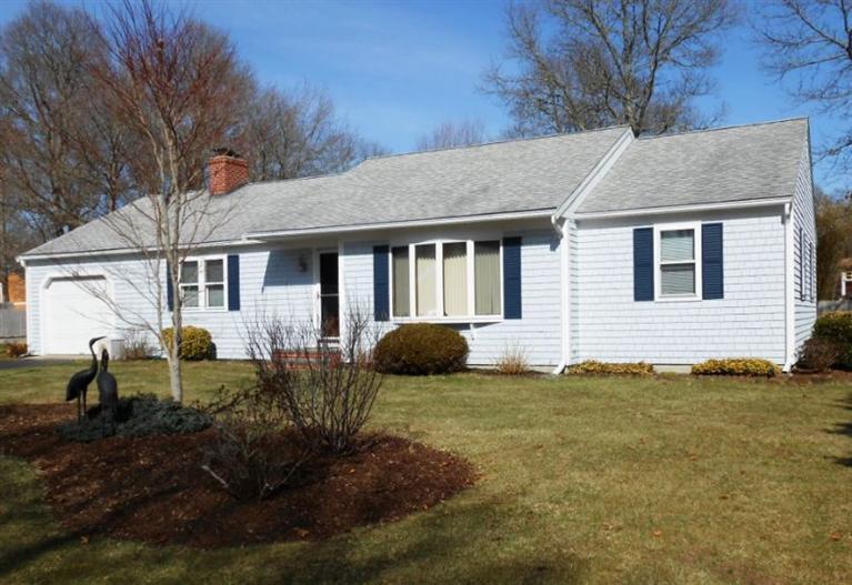 126 James Otis Road Centerville, MA 02632 - Photo 1 of 17 a view of a house with backyard and garden