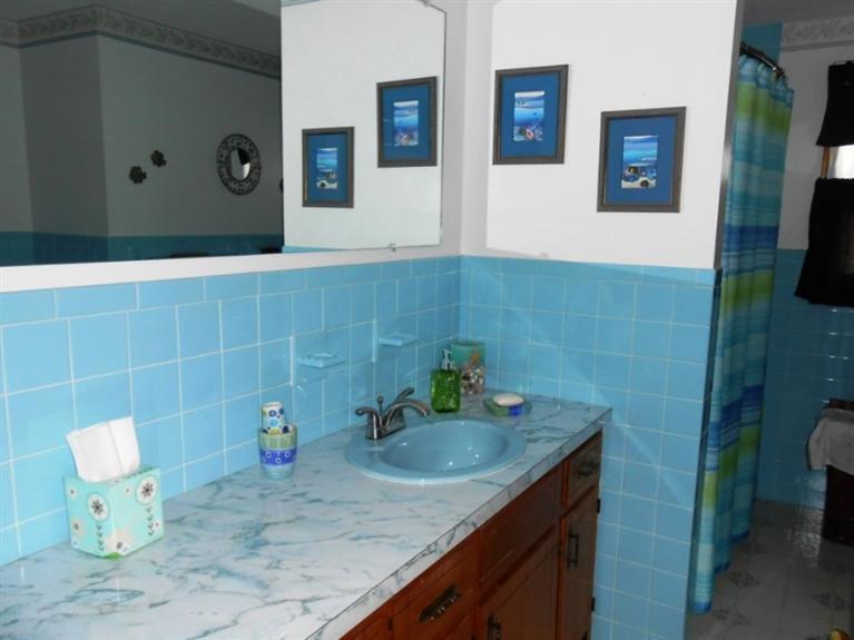 126 James Otis Road Centerville, MA 02632 - Photo 11 of 17 a bathroom with a granite countertop sink a mirror and shower