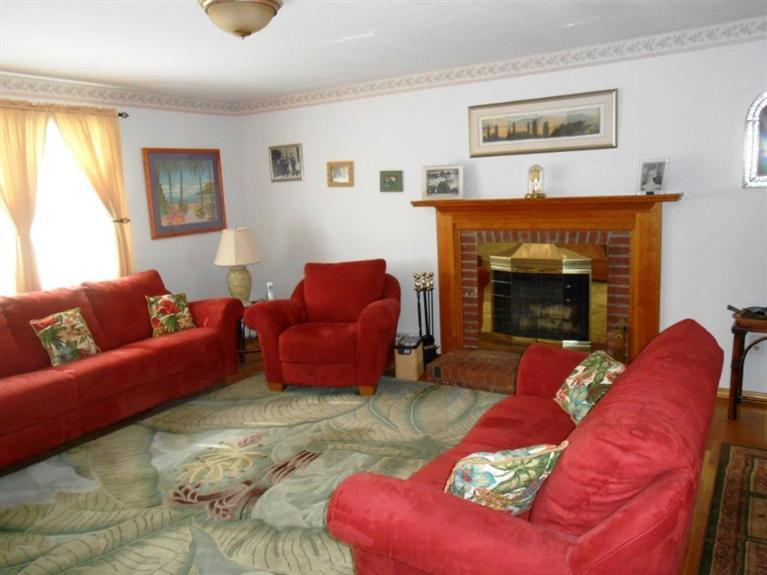 126 James Otis Road Centerville, MA 02632 - Photo 2 of 17 a living room with furniture fireplace and a window