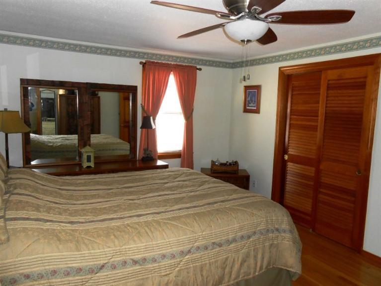 126 James Otis Road Centerville, MA 02632 - Photo 8 of 17 a bedroom with a bed and a large window