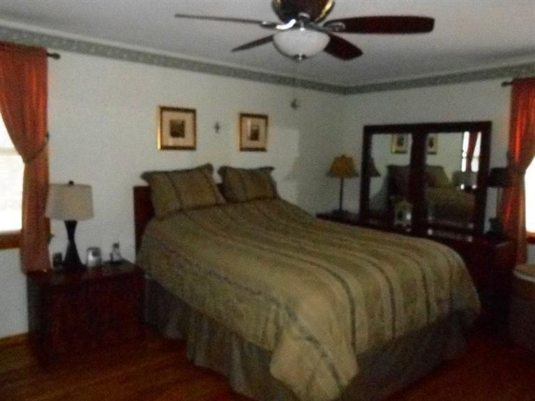 126 James Otis Road Centerville, MA 02632 - Photo 9 of 17 a bedroom with a large bed and a window