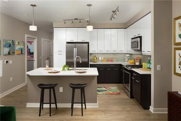 a living room with a couch and a dining table