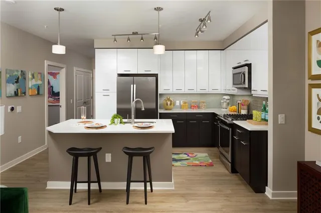 a living room with a couch and a dining table
