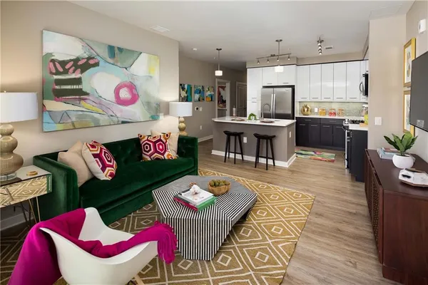 a kitchen with a sink and stainless steel appliances