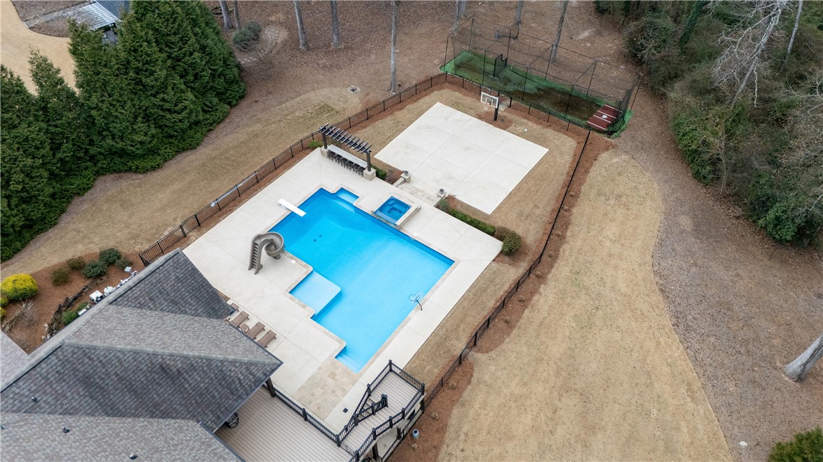 301 Stonebridge Drive Clemson, SC 29631 - Photo 6 of 47 This spacious outdoor retreat features a sparkling pool and recreational court amidst natural landscaping.