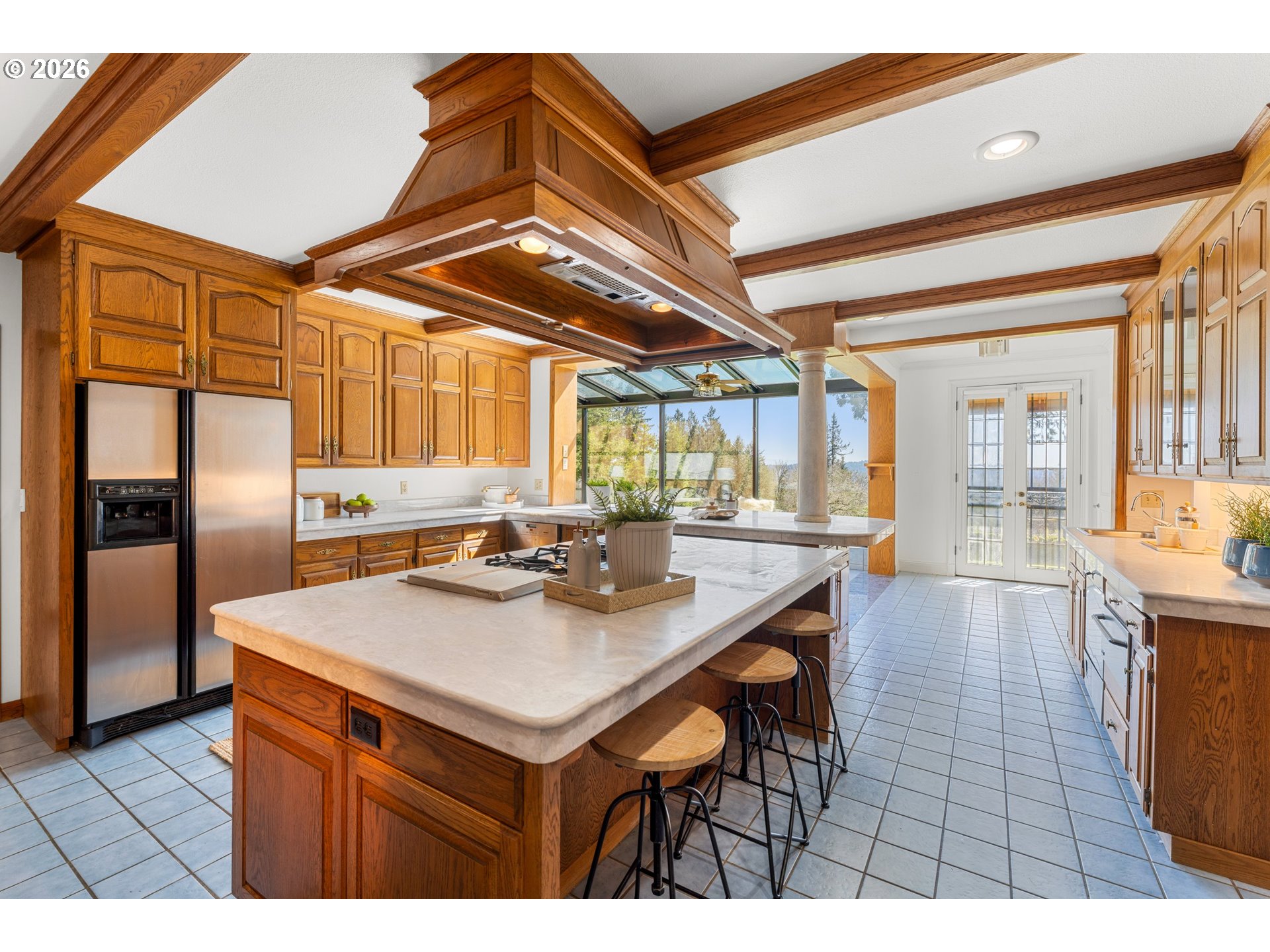 2732 Southwest Scholls Ferry Road Portland, OR 97221 - Photo 14 of 46 a kitchen with stainless steel appliances granite countertop a sink a oven and a refrigerator