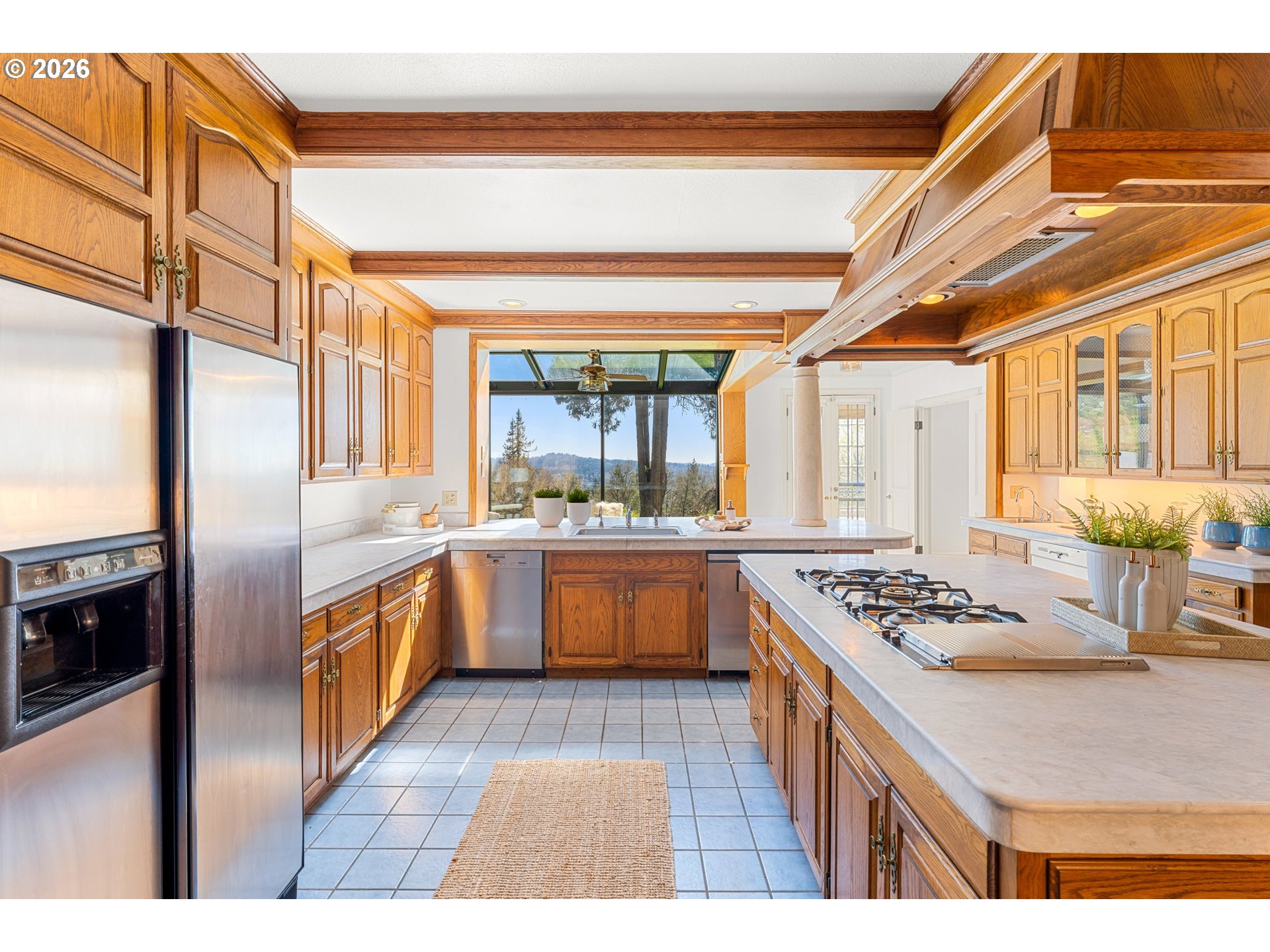 2732 Southwest Scholls Ferry Road Portland, OR 97221 - Photo 15 of 46 a kitchen with stainless steel appliances granite countertop a sink and stove