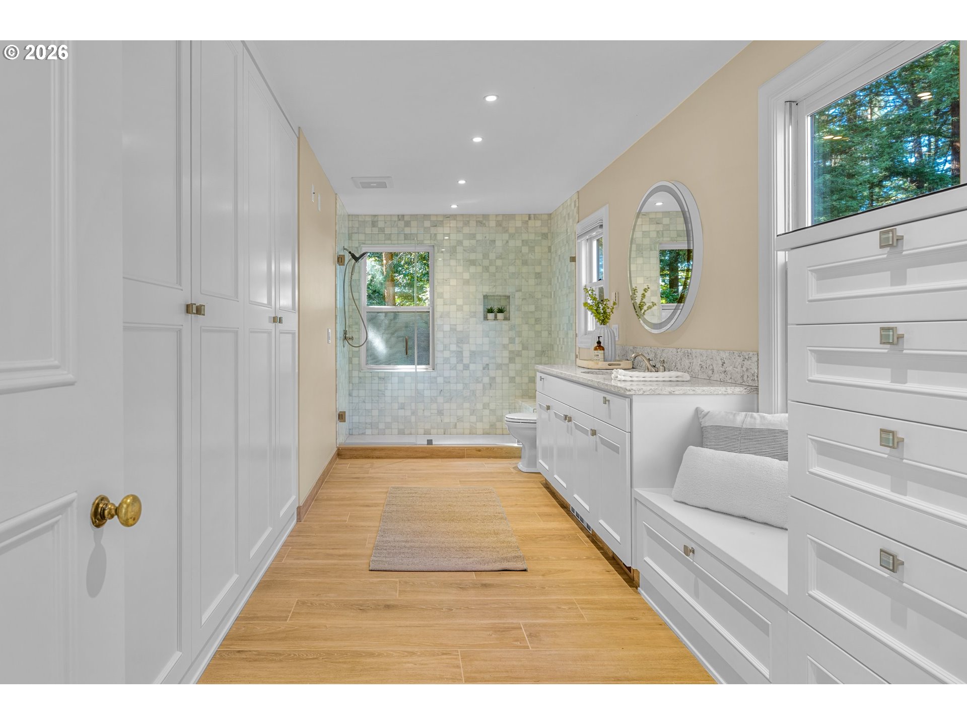 2732 Southwest Scholls Ferry Road Portland, OR 97221 - Photo 25 of 46 a bathroom with a sink a bathtub and a window