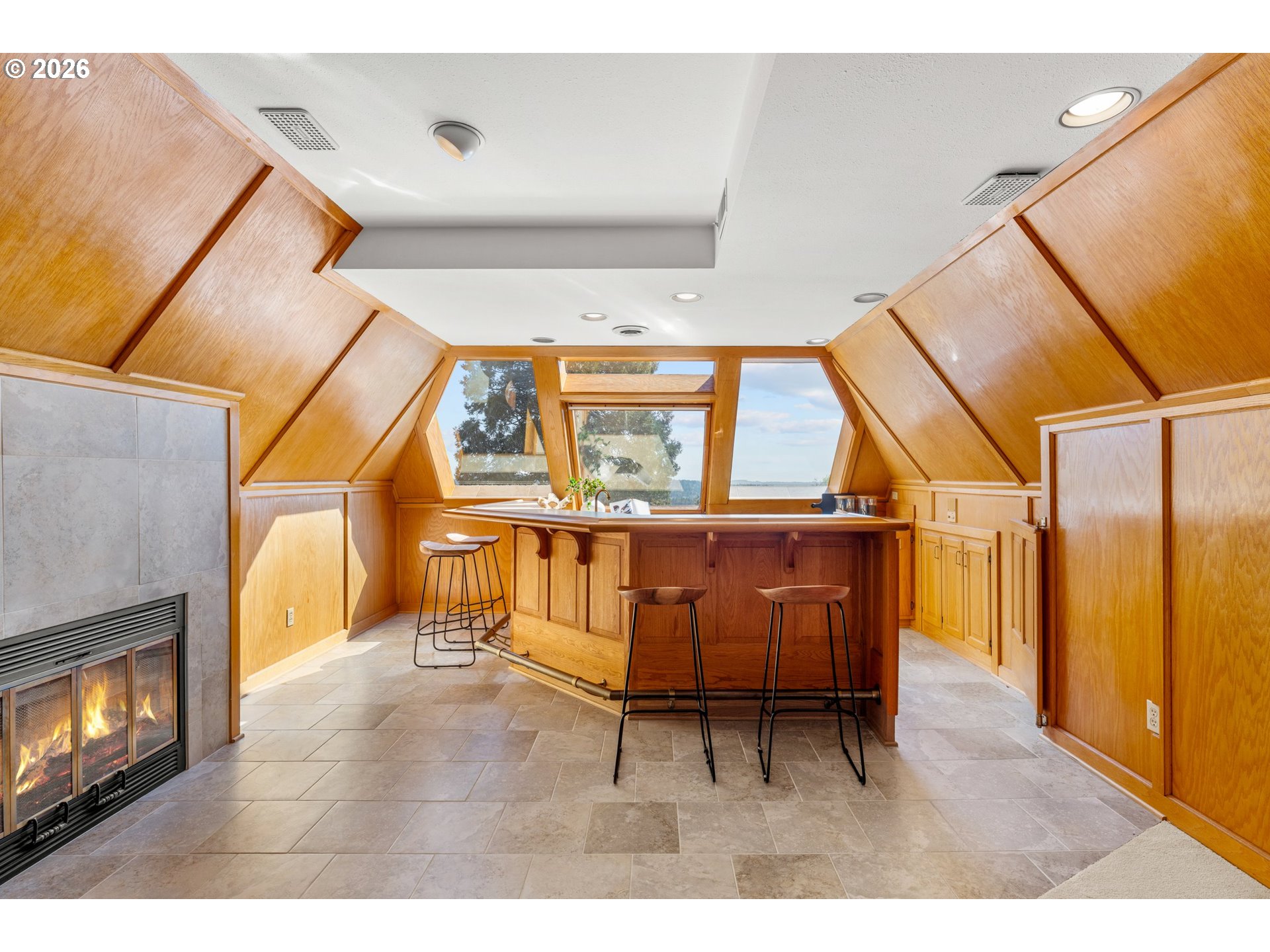 2732 Southwest Scholls Ferry Road Portland, OR 97221 - Photo 31 of 46 a living room with furniture and a fireplace