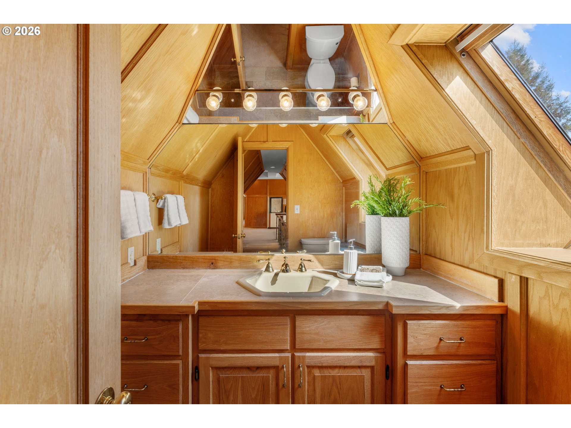 2732 Southwest Scholls Ferry Road Portland, OR 97221 - Photo 32 of 46 a bathroom with a sink and a mirror