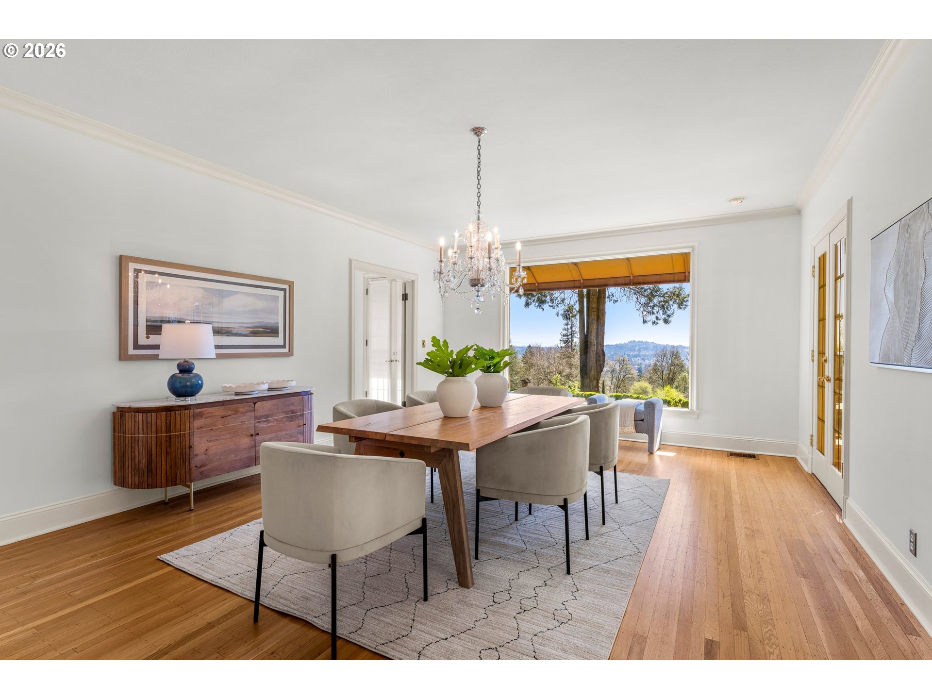 2732 Southwest Scholls Ferry Road Portland, OR 97221 - Photo 9 of 46 a dining room with furniture a chandelier and wooden floor