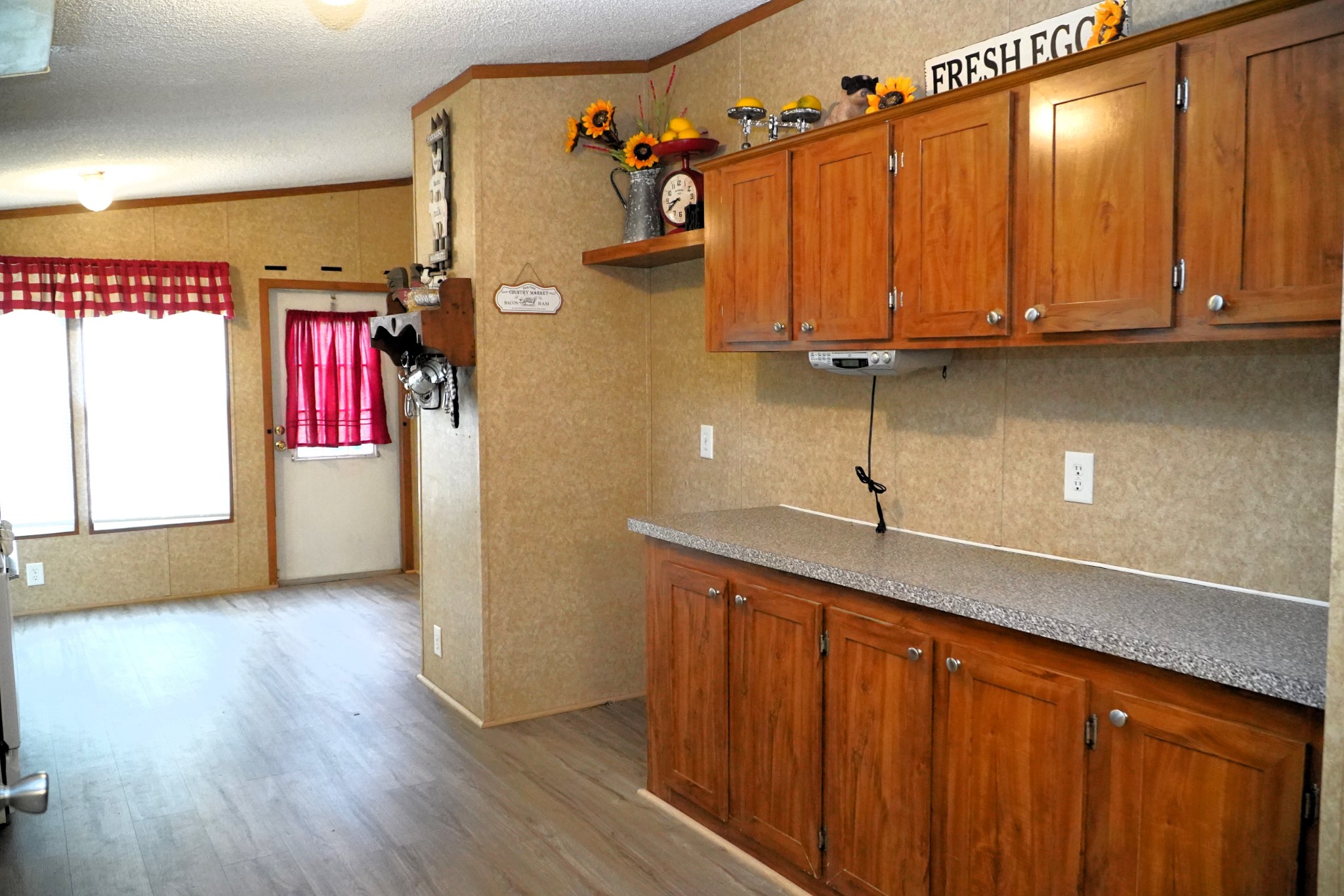 237 Red Oak Road Petersburg, TN 37144 - Photo 12 of 57 a kitchen with stainless steel appliances granite countertop a refrigerator a sink dishwasher and wooden cabinets with wooden floor