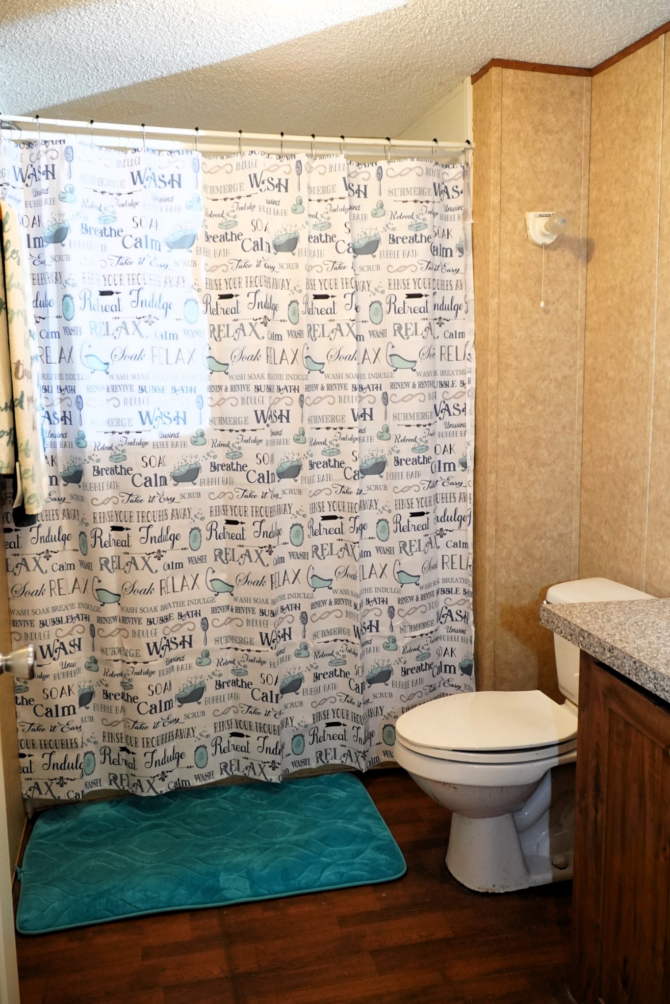 237 Red Oak Road Petersburg, TN 37144 - Photo 29 of 57 a bathroom with a toilet and a shower curtain