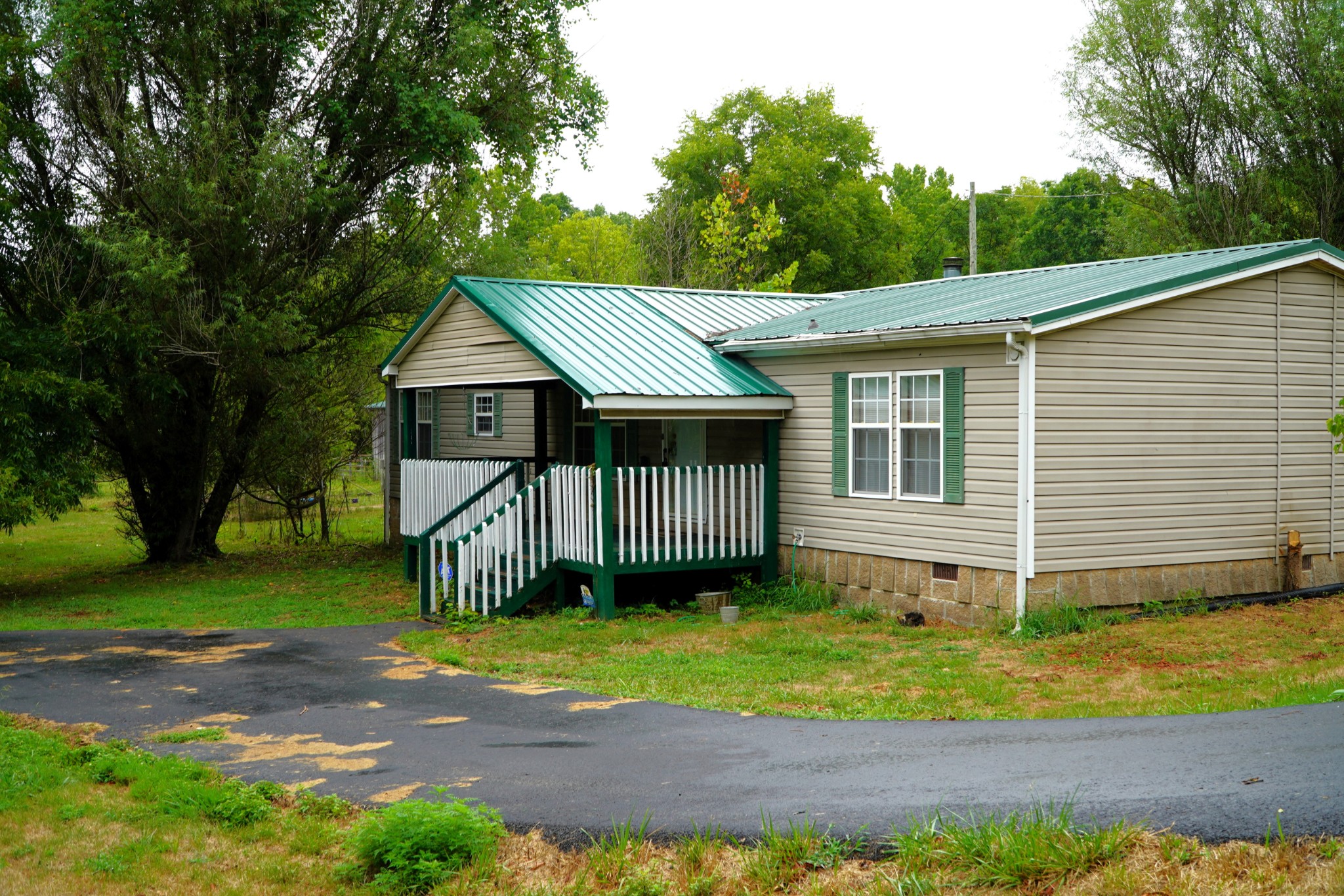 237 Red Oak Road Petersburg, TN 37144 - Photo 57 of 57 a front view of a house with a garden and yard