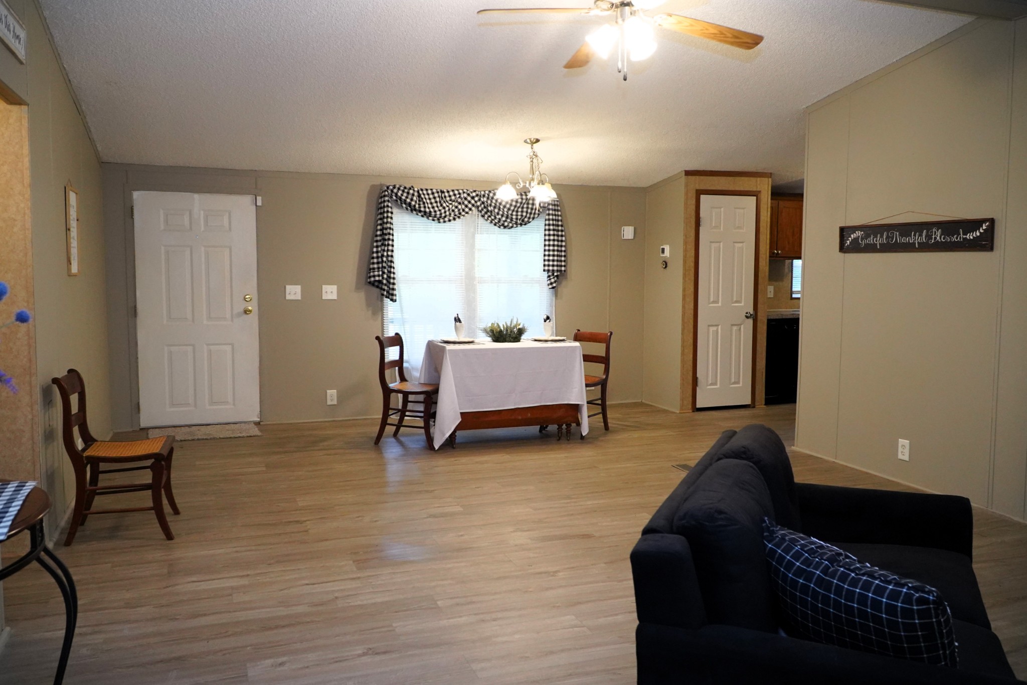 237 Red Oak Road Petersburg, TN 37144 - Photo 9 of 57 a spacious bedroom with a bed and a chandelier
