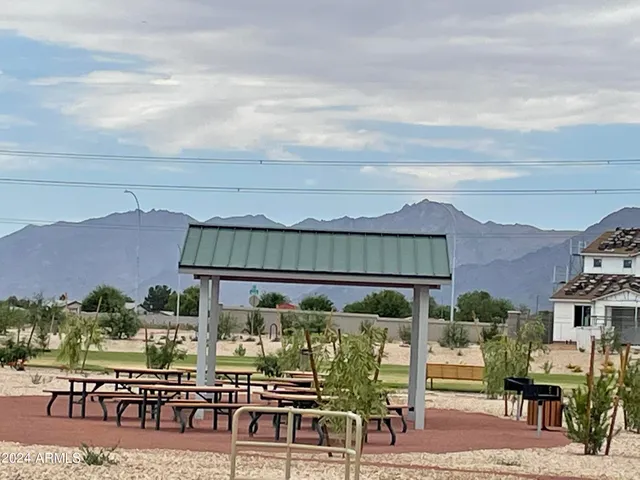 a view of a chairs and table in patio