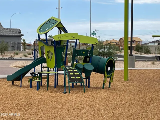 a view of a swimming pool with outdoor seating space