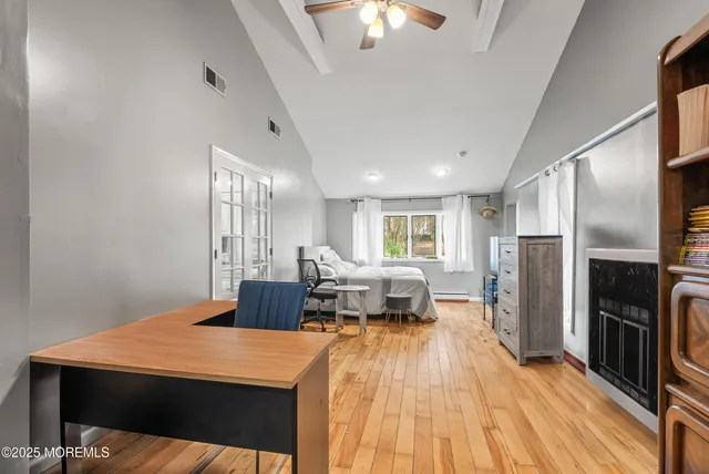 a large room with a bed and furniture