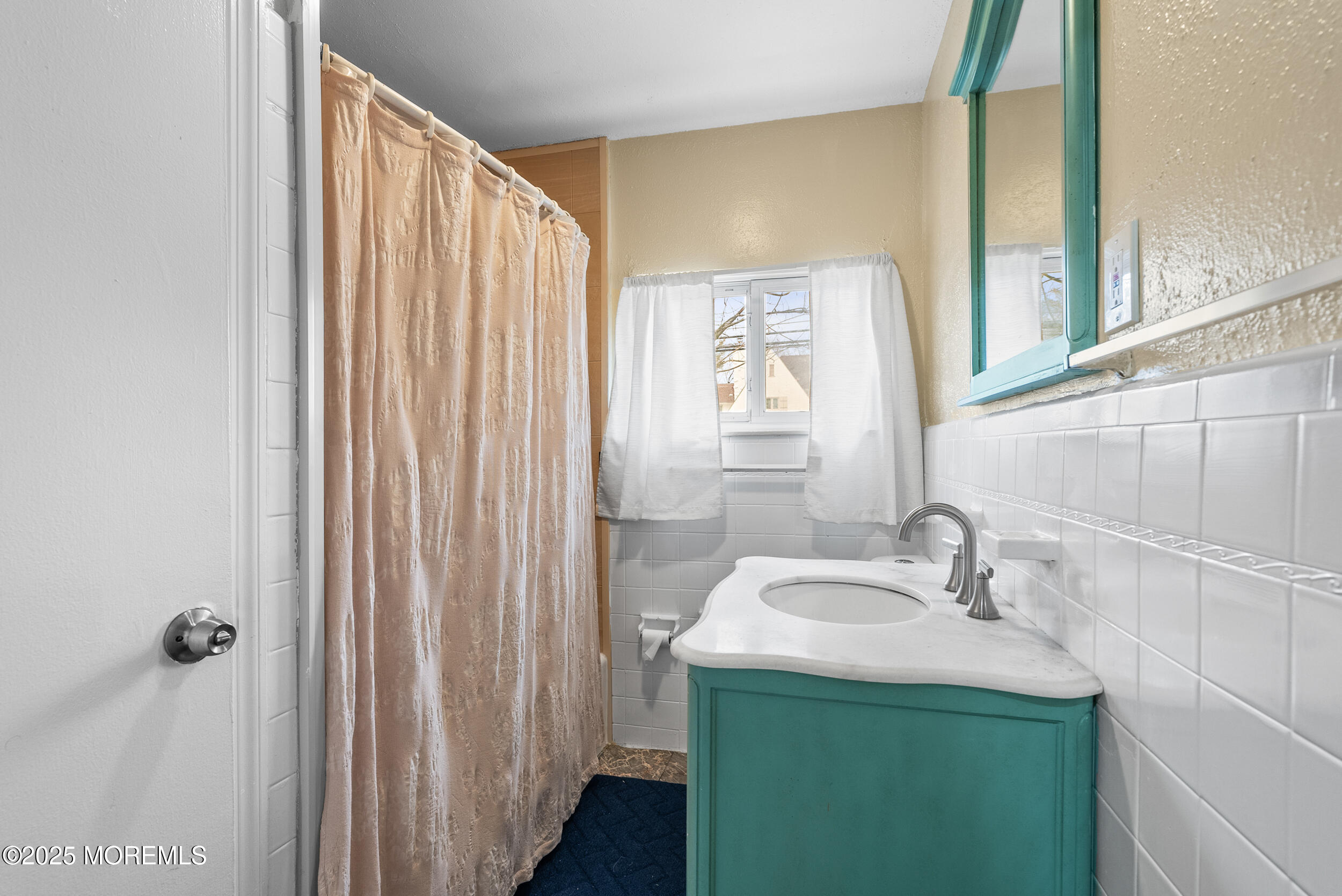 128 Beechwood Avenue West Long Branch, NJ 07764 - Photo 16 of 29 a bathroom with a sink and a mirror