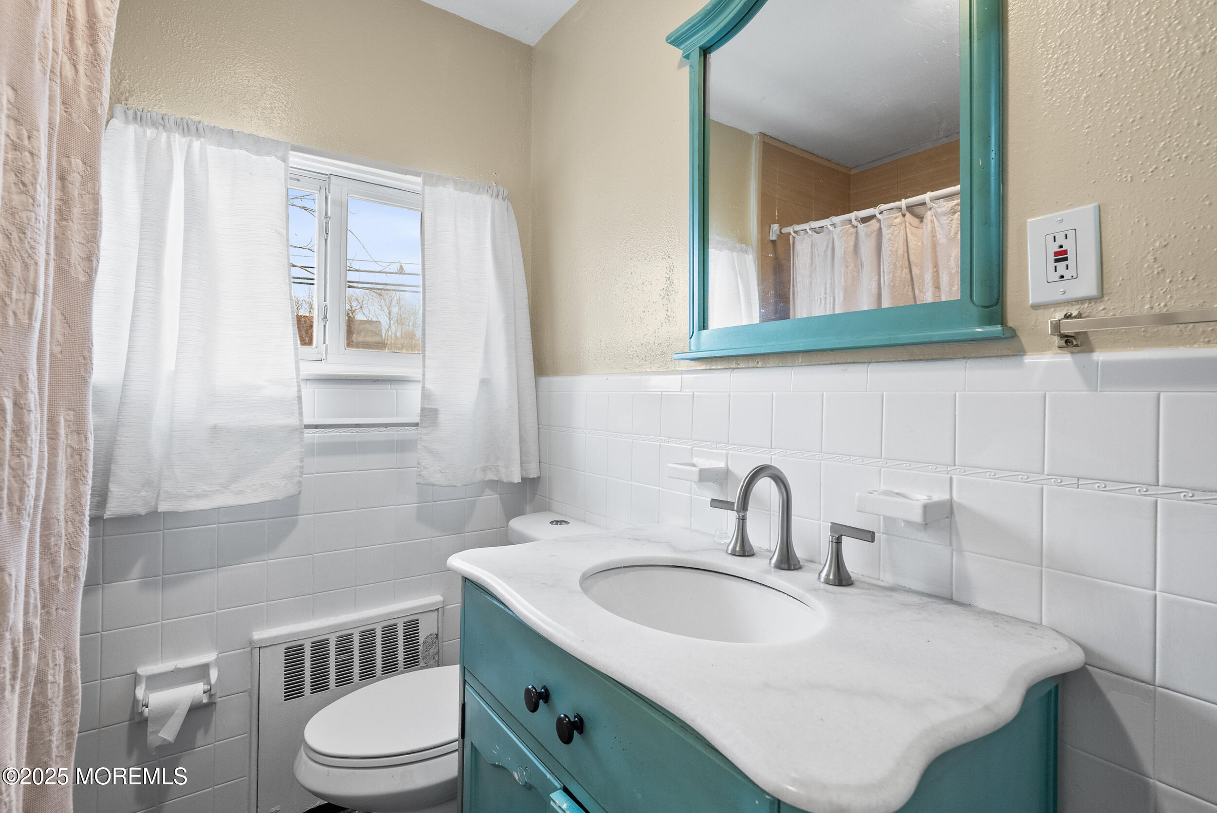 128 Beechwood Avenue West Long Branch, NJ 07764 - Photo 17 of 29 a bathroom with a sink toilet a mirror and shower
