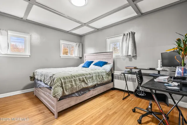 a bedroom with a bed and a table