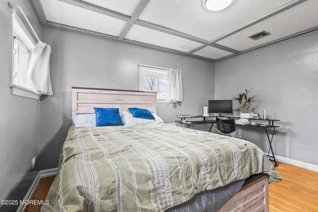 a bedroom with bed and chair