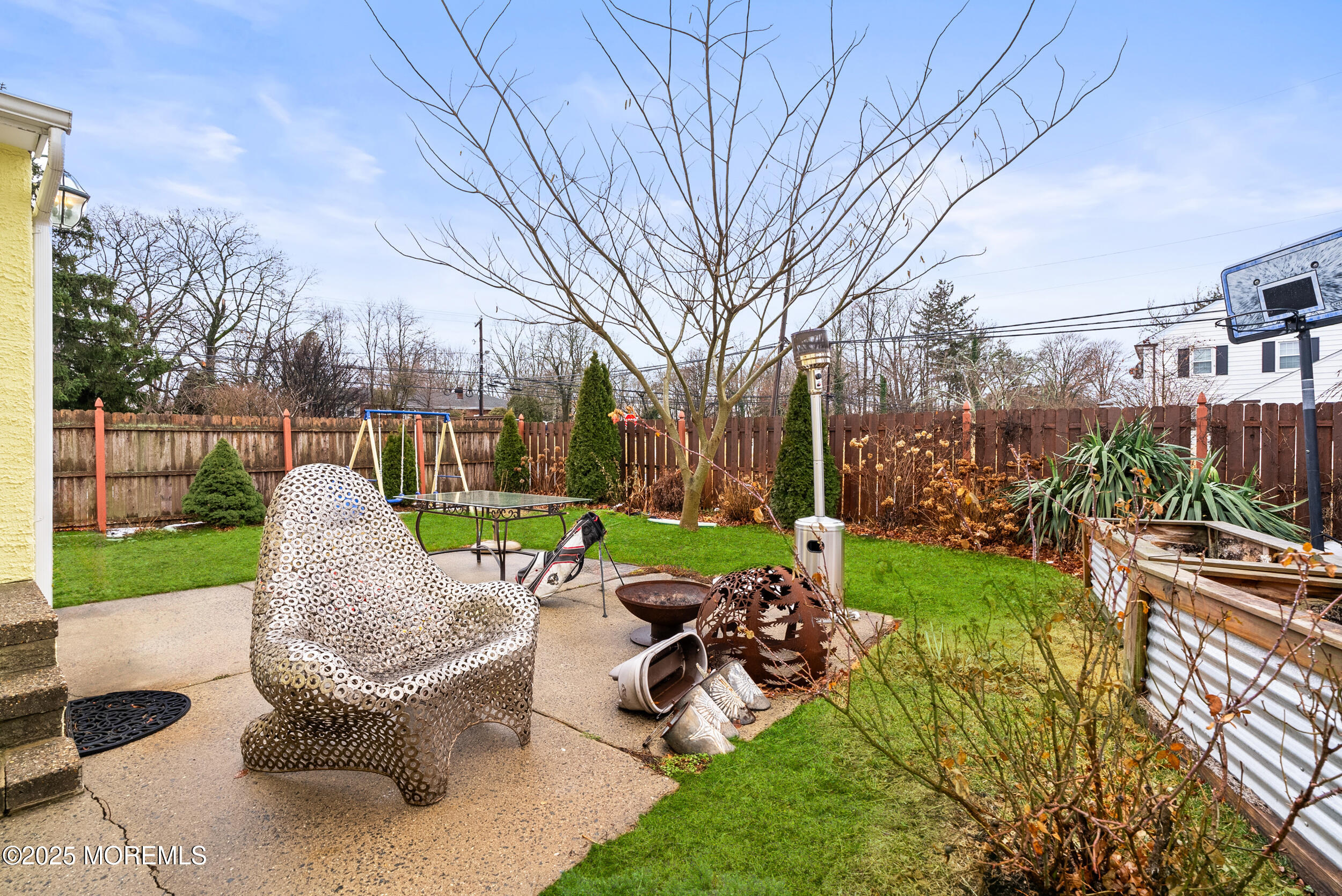 128 Beechwood Avenue West Long Branch, NJ 07764 - Photo 20 of 29 a view of a table and chairs in backyard of the house