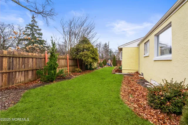 a backyard of a house with lots of green space