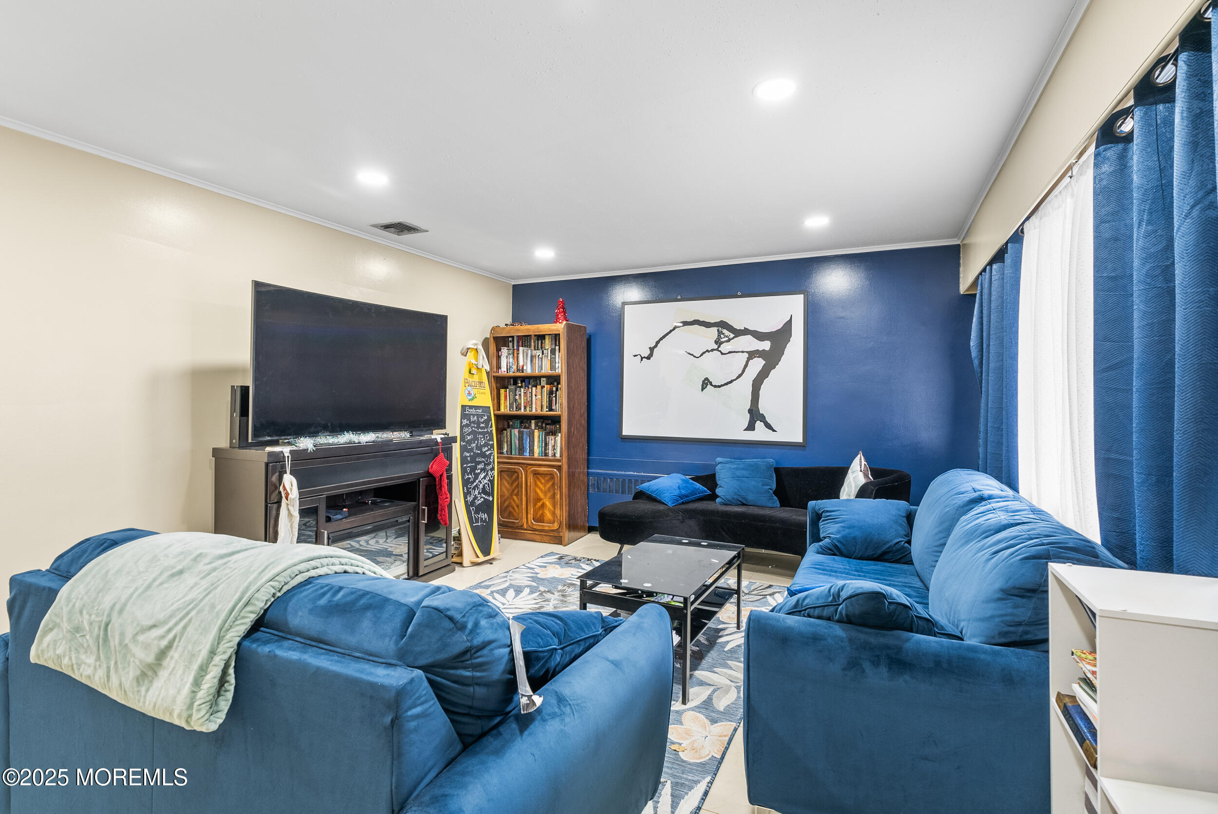 128 Beechwood Avenue West Long Branch, NJ 07764 - Photo 4 of 29 a living room with furniture and a flat screen tv