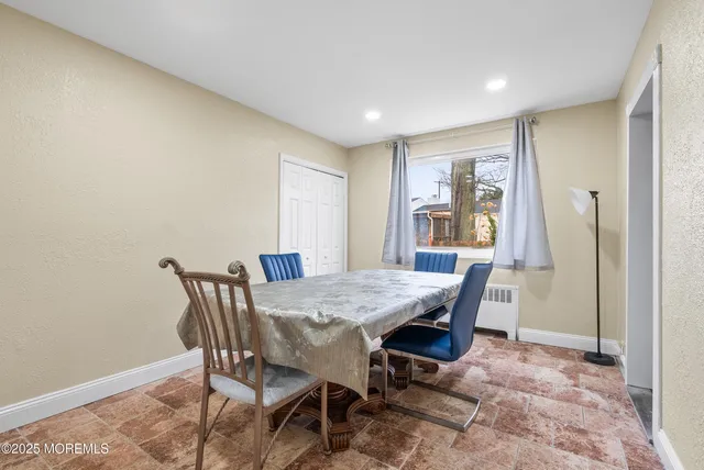 a view of a dining room with furniture
