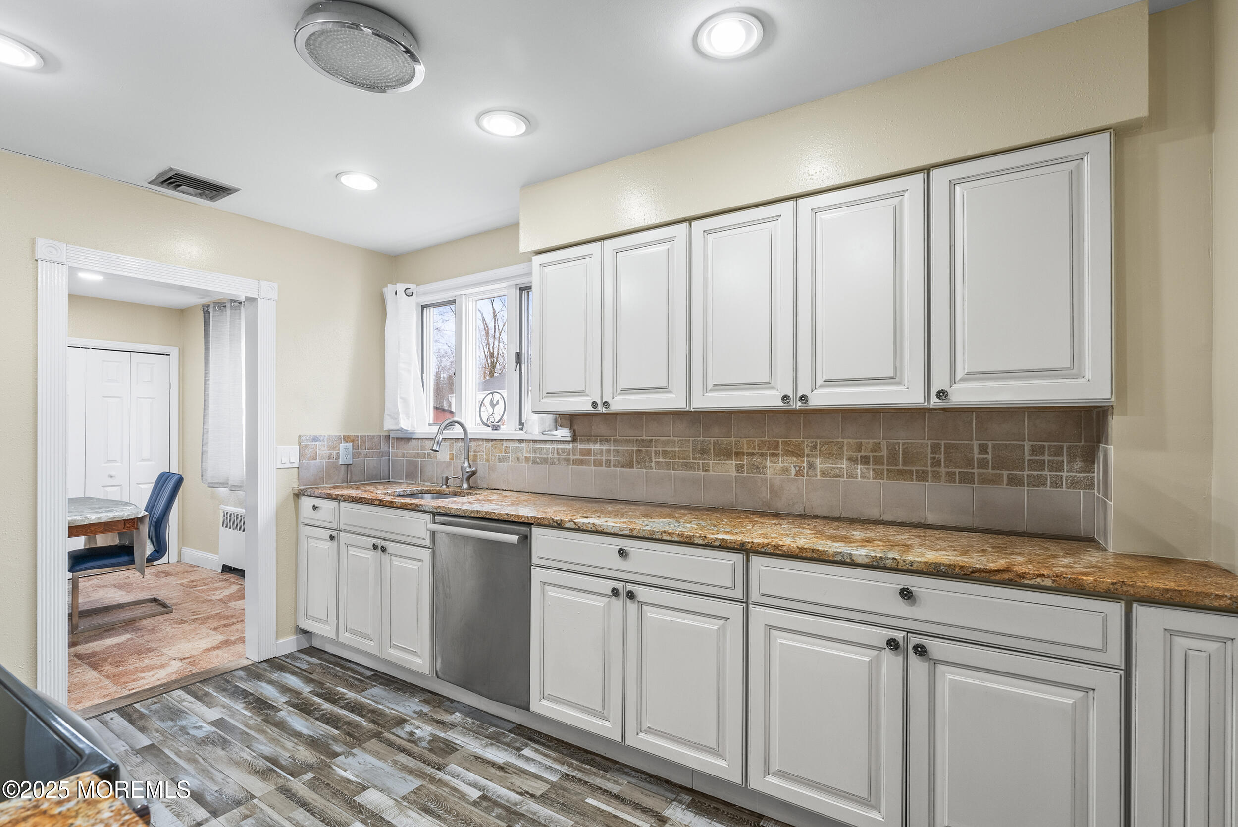 128 Beechwood Avenue West Long Branch, NJ 07764 - Photo 7 of 29 a kitchen with white cabinets
