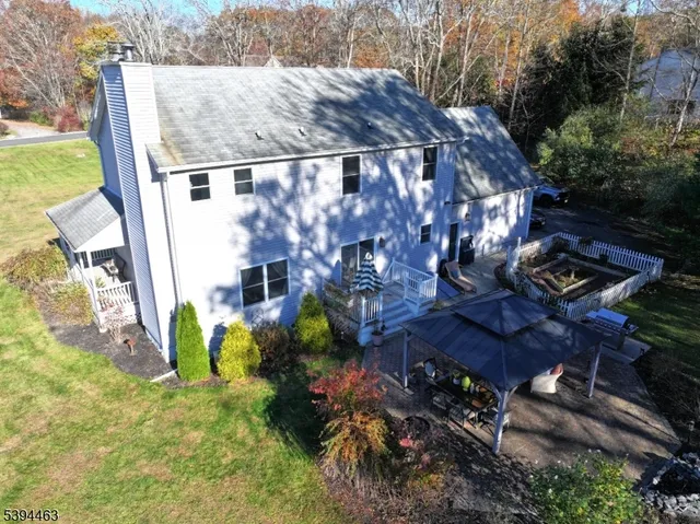 a living room with furniture pool table and a large window