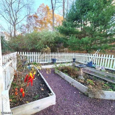 a bedroom with a bed and a ceiling fan