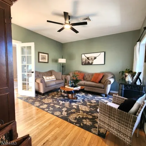 a view of a living room with a flat screen tv and a rug