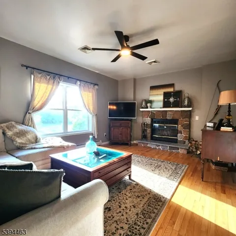 a view of a dining area with furniture window and wooden floor