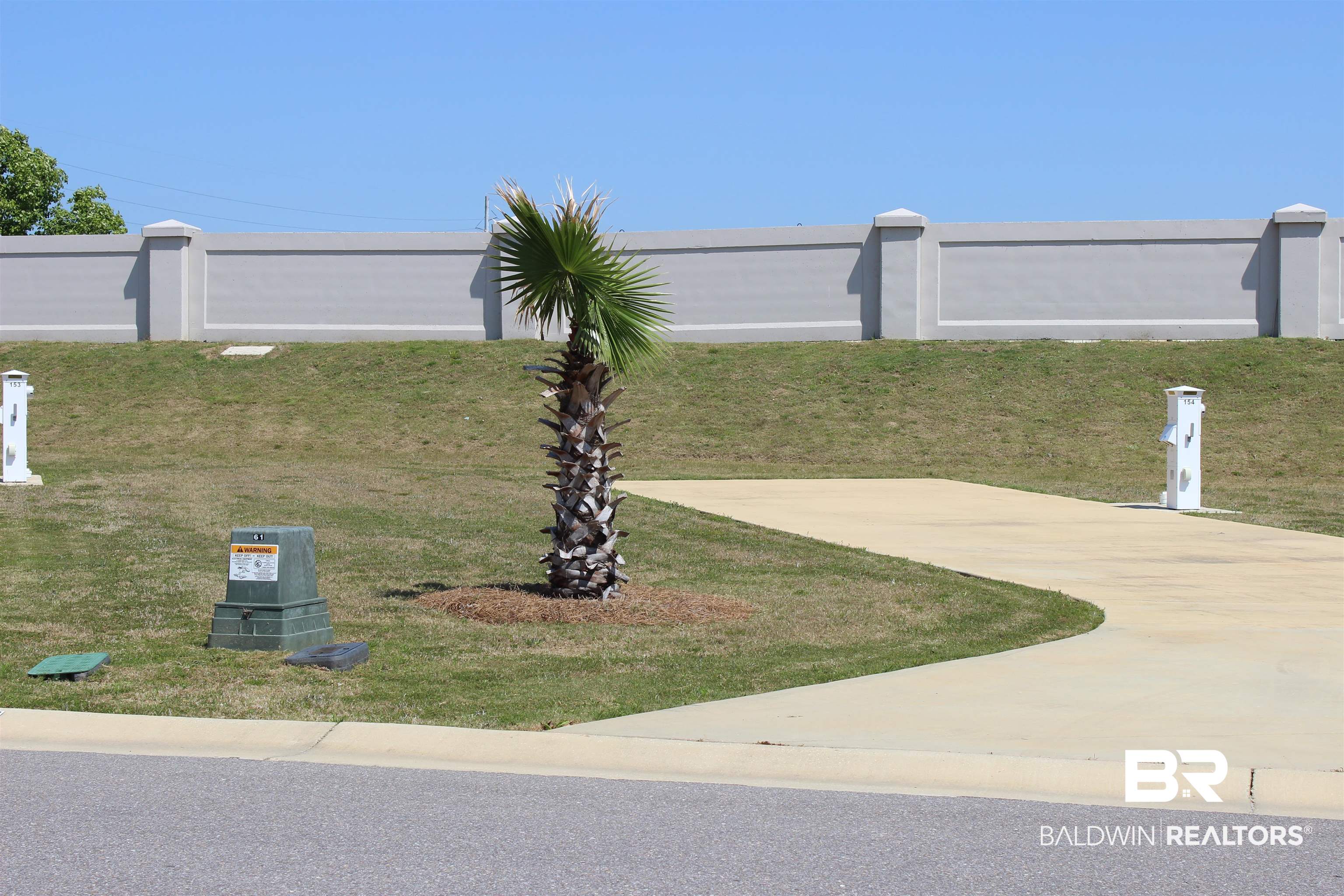 12277 Gateway Drive Elberta, AL 36530 - Photo 3 of 54 Surrounding community featuring a yard and fence