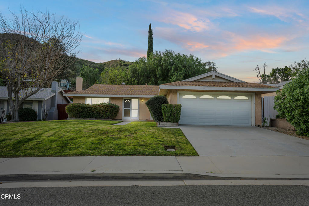 29443 Abelia Road Canyon Country, CA 91387 - Photo 31 of 31 a front view of a house with a garden