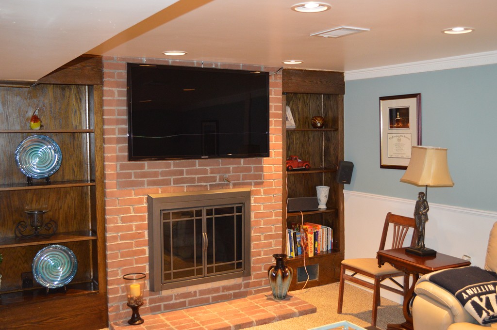 215 Hudson Road Sudbury, MA 01776 - Photo 15 of 18 a living room with furniture and a fireplace