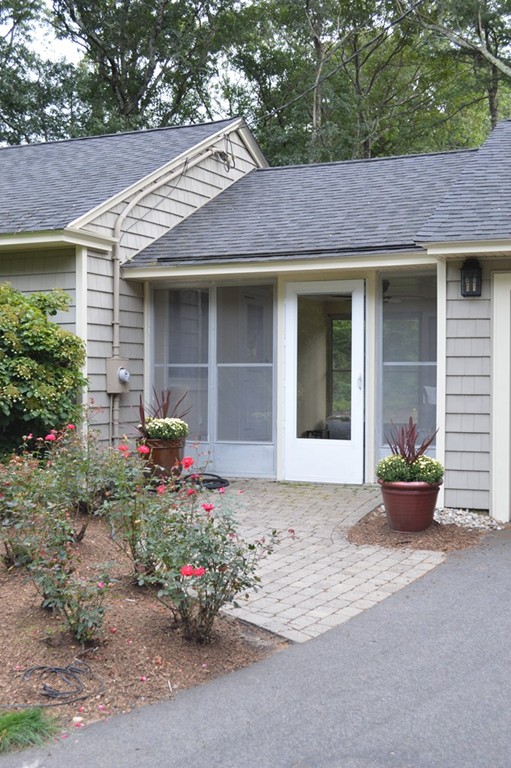 215 Hudson Road Sudbury, MA 01776 - Photo 4 of 18 a front view of a house with a yard