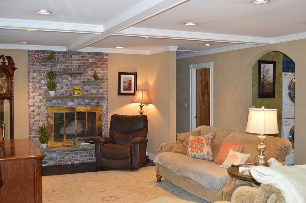 215 Hudson Road Sudbury, MA 01776 - Photo 8 of 18 a living room with furniture and a fireplace
