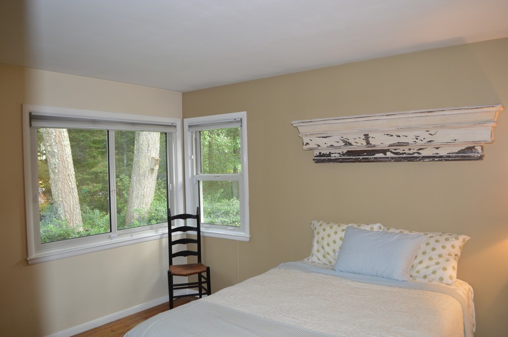 215 Hudson Road Sudbury, MA 01776 - Photo 9 of 18 a bedroom with a bed and a window