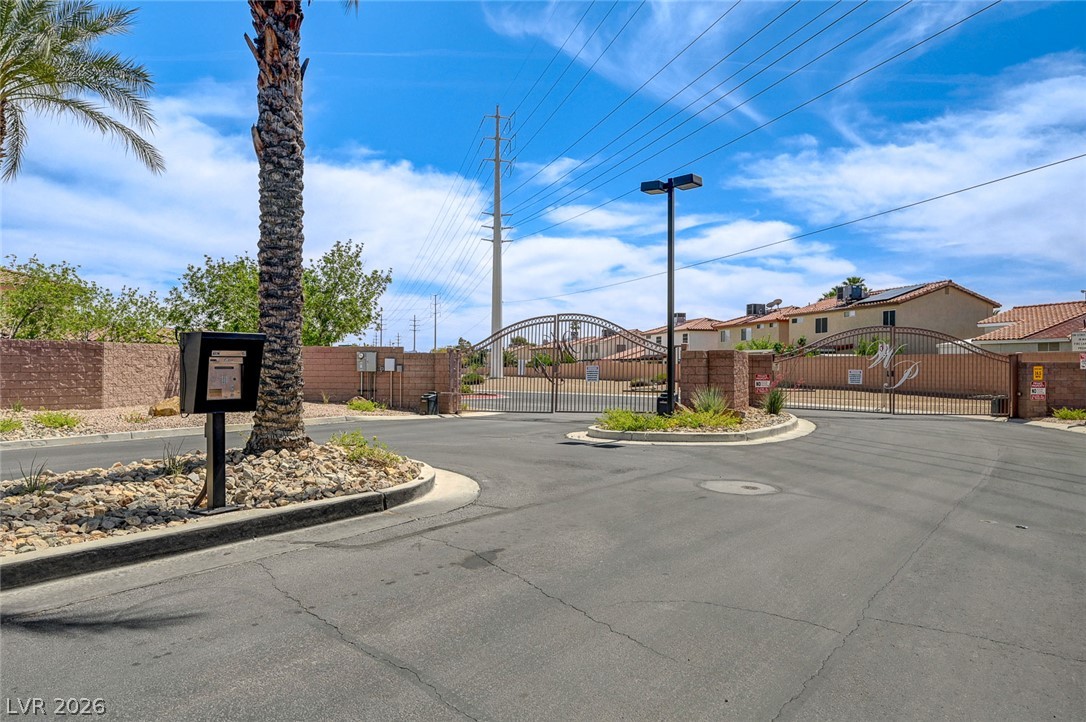 1479 Orange Jubilee Road Henderson, NV 89014 - Photo 36 of 36 Secure community entrance with an ornamental gated entry.