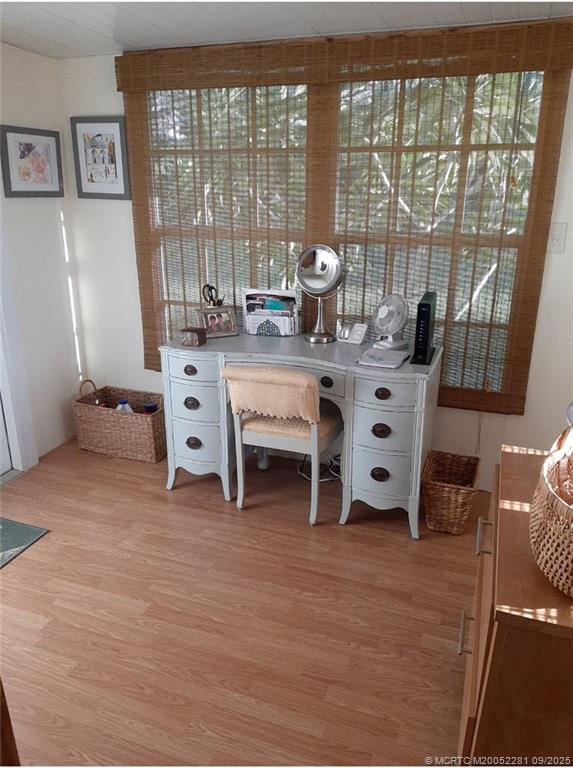 2686 Southwest Monarch Trail Stuart, FL 34997 - Photo 15 of 15 a living room with furniture and large windows