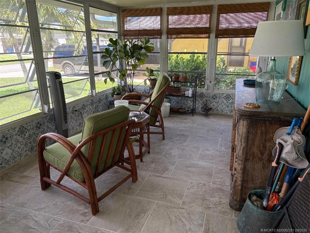 2686 Southwest Monarch Trail Stuart, FL 34997 - Photo 3 of 15 a view of a dining room with furniture window and outside view